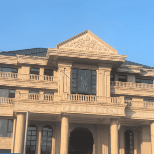 泸州黄金麻别墅外墙干挂石材效果示例